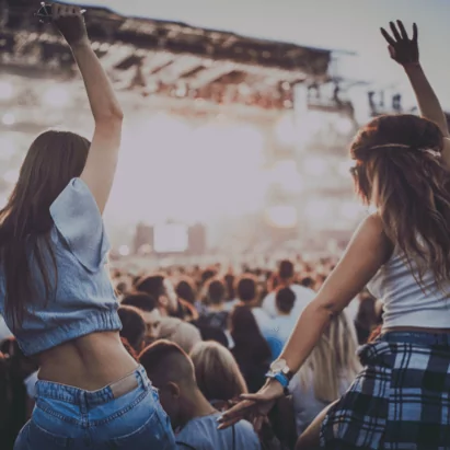 Two women enjoying a live concert