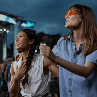 Two concert attendees enjoying the live concert