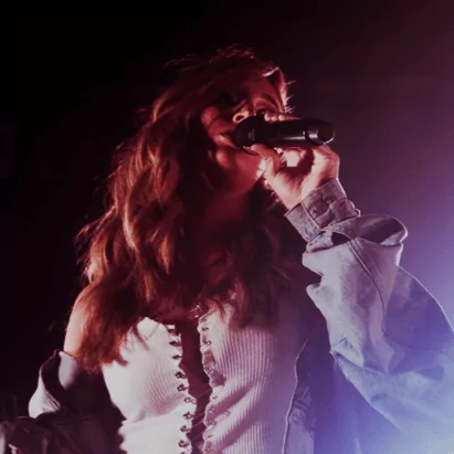 Lead Singer singing with microphone in her hand